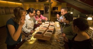 A half-dozen coffee connoisseurs participate in a “cupping lab” at Storyville’s test kitchen and roasting headquarters on Coppertop Loop. Such quality control events occur on a smaller scale daily at Storyville’s roasting studio.