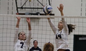 Erica Sprott and Sydney Maria block a shot against Lakeside in action Wednesday in Paski Gymnasium.