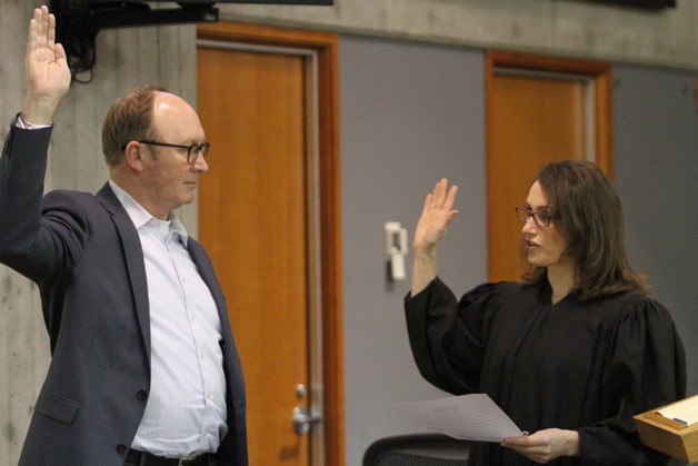 Michael R. Scott takes the oath of office as Bainbridge Municipal Judge Sara L. McCulloch administers the oath.