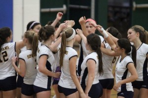 The Spartans huddle before the start of the team's first Metro League matchup.