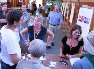 Joie Olson and Carrie Zech with Asani Development greet islanders during a public meeting to discuss changes to Phase II of the Grow Community on Monday