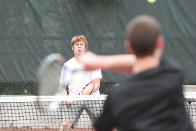 Ben DeVries eyes the return during his No. 1 boys doubles match with Keet Curtis against Sam Blattner and Ryan Doerfler of Seattle Prep.