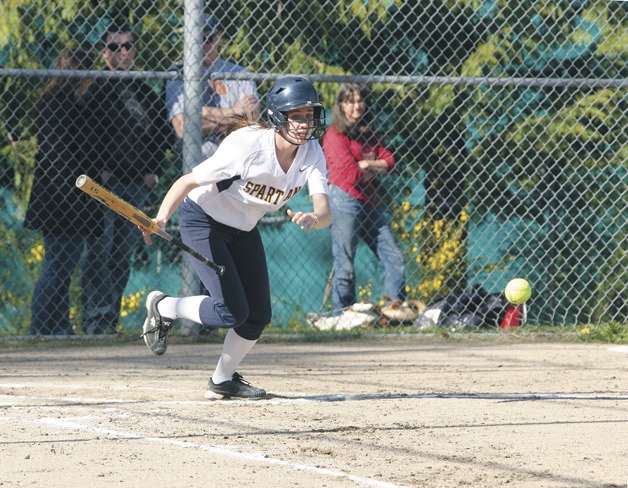 Katie Raben of Bainbridge High takes off after a bunt against Lakeside.