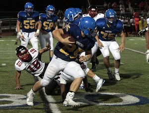 Bainbridge senior Sam Wysong runs through the defenses of the visitors from Cleveland High during last week's home game