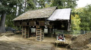 Historic Yeomalt cabin rests on cribbing this week