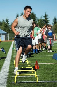 Returning Spartan football player and BHS senior Gareth Grindeland makes his way through speed and agility drills Wednesday