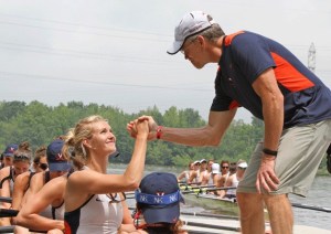 Virginia head coach Kevin Sauer wishes Keziah Beall good luck before the final NCAA championship race at Mercer Lake in West Windsor