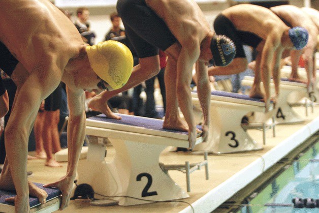 Kevin Yalung prepares to burst from the block in the 50-yard freestyle. He finished in eighth place.