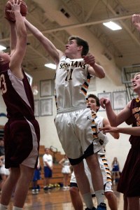 BHS sophomore guard Brendan Burke tries for a rebound Saturday.