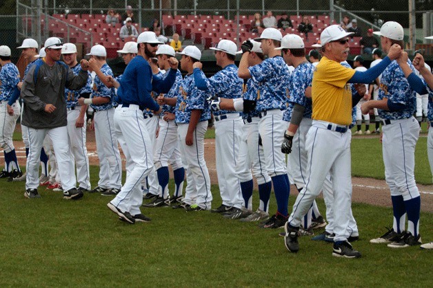 The BHS coaching staff enter the field and psyche up the varsity baseball team just prior to the start of the their first 2014 3A Baseball Region III Tournament playoff game