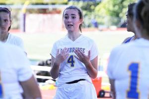 Team captain Ellie Van Slyke talks to her teammates during a halftime break.