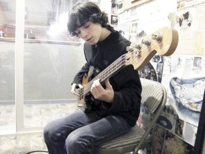 A student brushes up his bass skills with instructor Steve Newton. The Island Music Center provides an opportunity for students to build a passion for the arts.