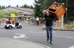 A shopper carries away a purchase from the 56th annual Rotary Auction.