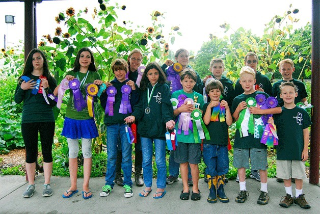 Bainbridge 4-H members display their ribbons from the county fair.