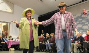 Two seniors take to the catwalk during the 'Love is in the Air' senior fashion show.