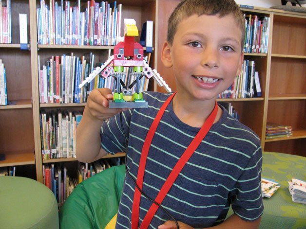 Miguel Guillen-Kushner shows off the robotic bird he made during last week’s STEAM camp at Wilkes.