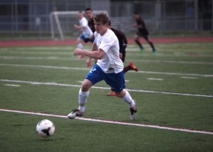 BHS senior forward Tanner Salmon drives the ball toward the O'Dea goal Tuesday