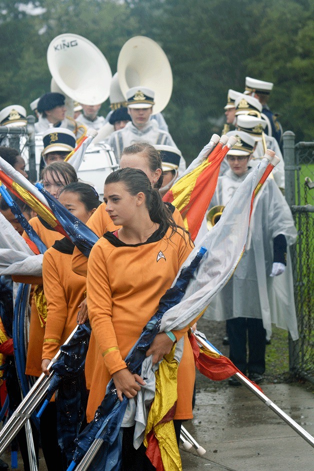 Megan Sellman and the Color Guard wait to enter the stadium. Rain made the compettion coordinators cancel the planned parade of bands scheduled for the end of the event and the drum majors had to accept the awards.