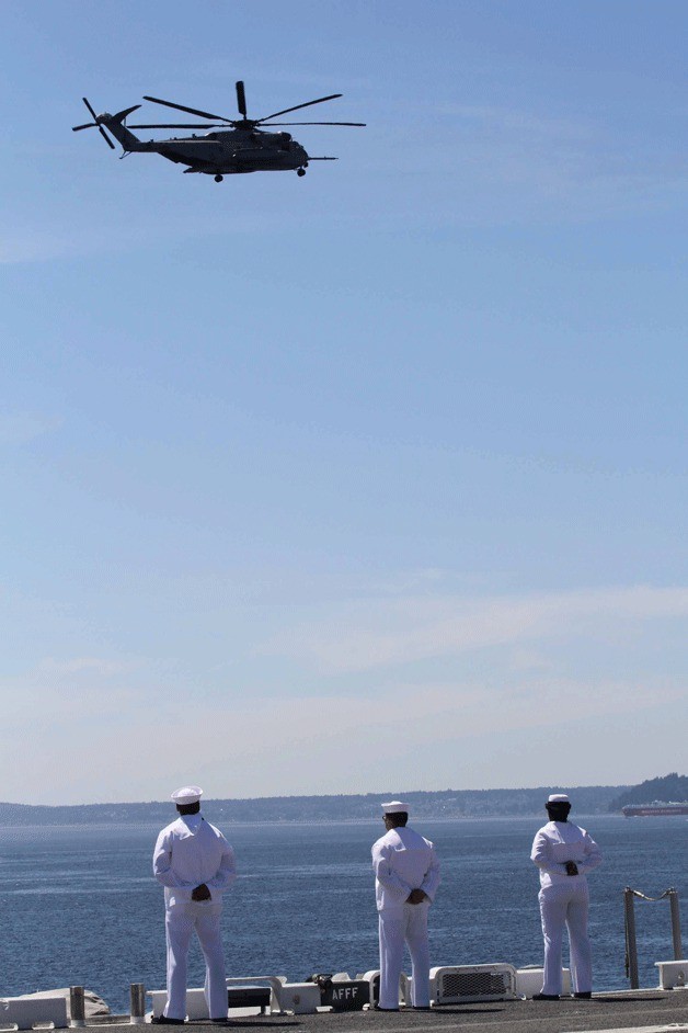 Sailors man the rails of the amphibious assault ship USS Essex during Seafair's Parade of Ships