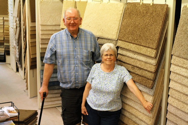 Steve Shawley and Judy Dulay pause for a photo on their last day in their Winslow Way store.