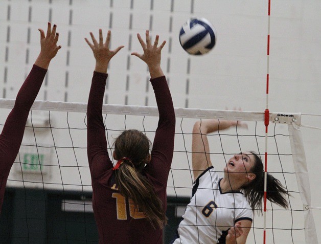 Bainbridge Spartan Hannah Wagner reels back to return a shot during the first set against the Lions.