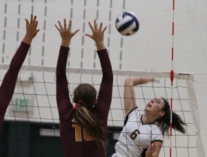 Bainbridge Spartan Hannah Wagner reels back to return a shot during the first set against the Lions.