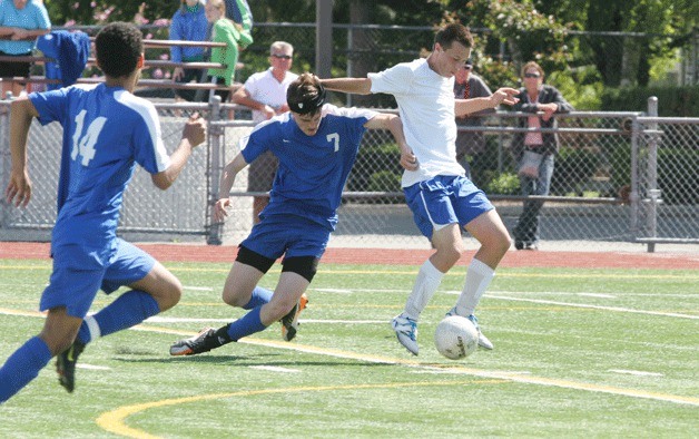 Peter Fawley races past Peter Prescott of Mountain View to score one of his two goals late in the second half against the Mighty Thunder.