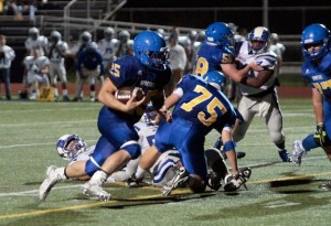 BHS’ Sam Wysong plows through the line at the Spartans' home game against Ingraham. The senior Spartan gave a stellar performance