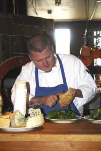 Hitchcock owner/chef Brendan McGill prep's a dish for his patrons.