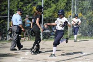 Spartan senior Carolyn Williams crosses home plate during Bainbridge’s 10-0 victory over Chief Sealth.