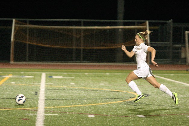 Spartan Natalie Vukic rolls to the goal and leaves the Blanchet goalkeeper in the dust during Bainbridge’s 3-1 win Tuesday.