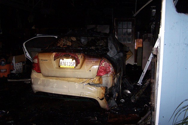 A fire destroyed a garage and car on Meadowlark Lane Monday morning. The home suffered smoke damage.