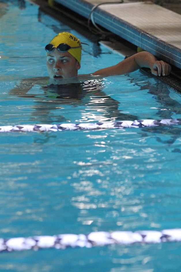 Mikelle Ackerley waits for others to finish after coming in first during a recent race in the 200-yard freestyle. Ackerley and her Spartan teammates in the 200-yard freestyle relay — Ani Duni
