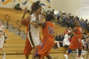 Ariel Fountain fights her way out of a Rainier Beach double team Wednesday night at Paski Gymnasium. The sophomore post scored eight points in the Spartans’ 56-28 win.
