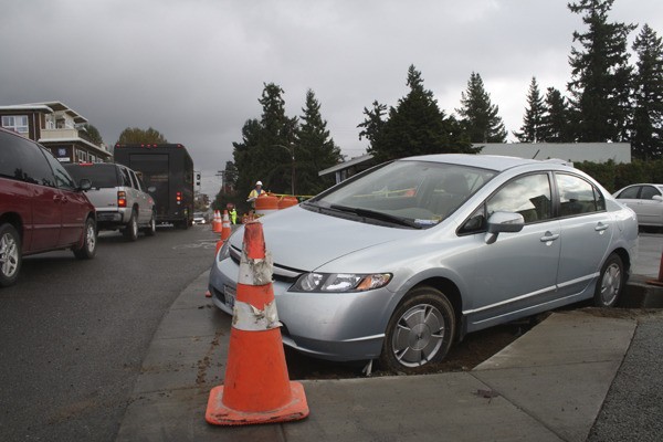 The vehicle crashed into the construction pit while trying to make a left-hand turn onto Winslow Way.