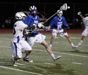 Spartan junior Ian Makin manages a pass under pressure Tuesday against Seattle Prep.
