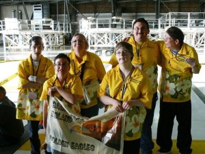 Members of the Golden Eagles from Bainbridge Island gather for a photo during opening ceremonies at the Special Olympics Washington Summer (State) Games. In front is Kristina Emery and Jennifer Mullis. In back