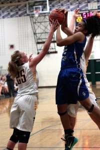 Kiera Havill grasps for the ball during a rebound scramble in Friday’s game against Seattle Prep. BHS will play at home again at 6 p.m. Tuesday