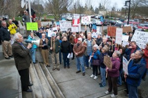Joe Honick addresses the marchers in front of city hall shortly before the city council’s meeting on Wednesday. He told them they made history that day and was met with cheers and chants of “nonconforming