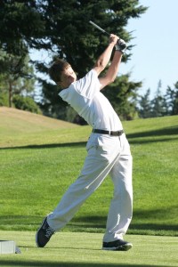 Tommy Zech of Bainbridge Island watches his shot during the Spartans first match of the season Tuesday against Nathan Hale.