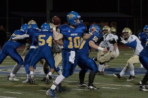 Quarterback Casey Brink looks to make a pass early in Friday's game against Bremerton High.
