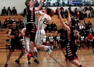 BHS junior Brendan Burke tries for a high flying shot at the hoop.