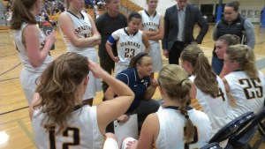 Spartans Coach Nicole Hebner tries to rally her team during a break in the action against Garfield Friday.