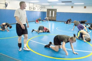 Spartan Head Coach Dan Pippinger (at left) shouts maneuvers to be completed during a drill at a recent practice session. This year’s BHS squad contains many returners