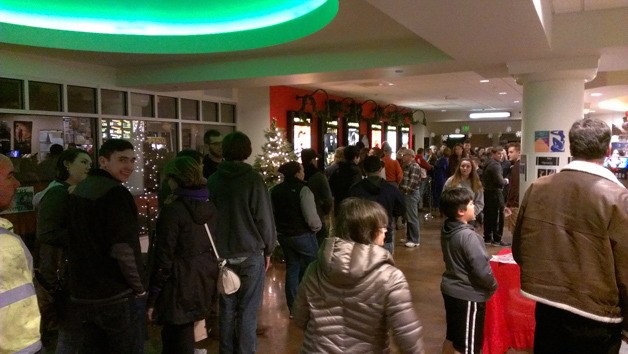 A line forms outside of Bainbridge Cinemas for the Friday night showing of 'The Interview.'