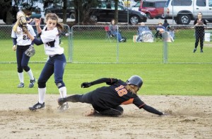 Central Kitsap shortstop Samantha Williams slides into second base during the Cougars’ opening game