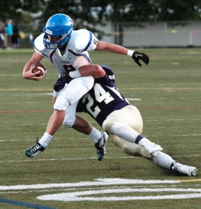 BHS junior running back Carter Daniels runs into the defensive efforts of the North Kitsap Vikings during the team’s first game of the season last week. The Spartans were defeated