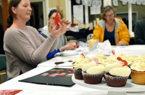 Christine Chapman of Crumbs Cakery shows BARN’s Kitchen Arts group how to do royal icing transfers for its first Third Thursday meeting.