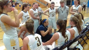 Bainbridge Coach Nicole Hebner talks to her team during Monday's matchup against Kingston.