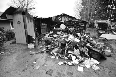 The fire was sparked by a short in a refrigerator cord in the garage. Suzanne Macpherson had her antique collection in the garage.